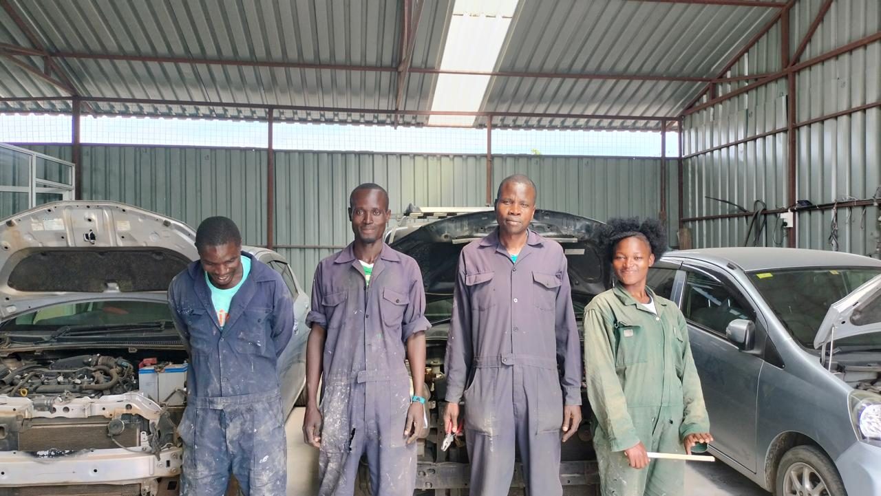 The ICD Road Garage team standing in the workshop